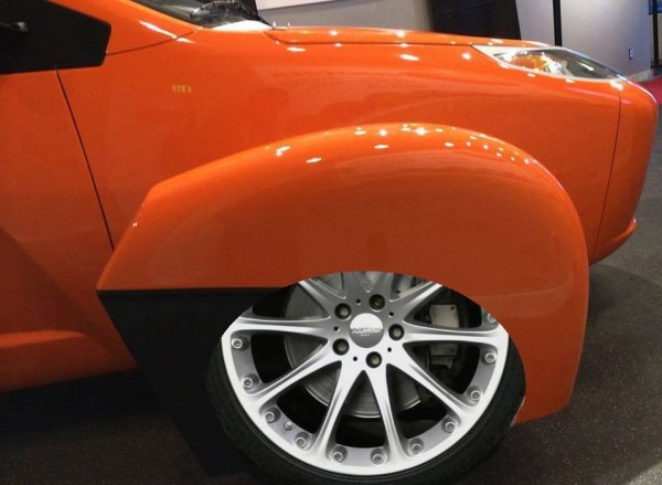 P4 Orange with open wheel covers.jpg