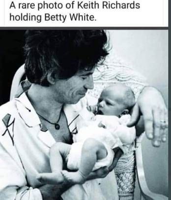 rare keith richards photo holding baby betty white.jpg